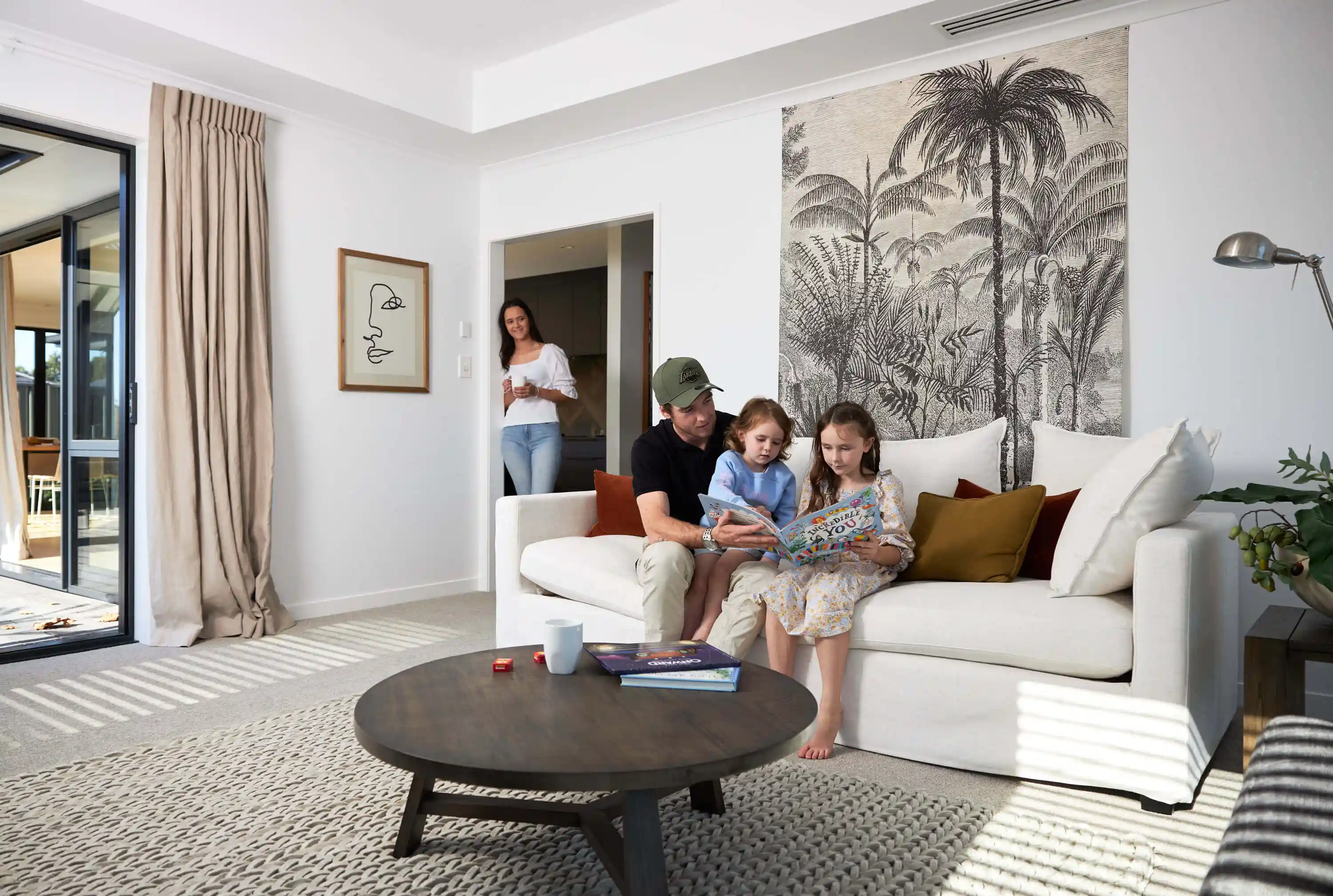 Dad reads book with children